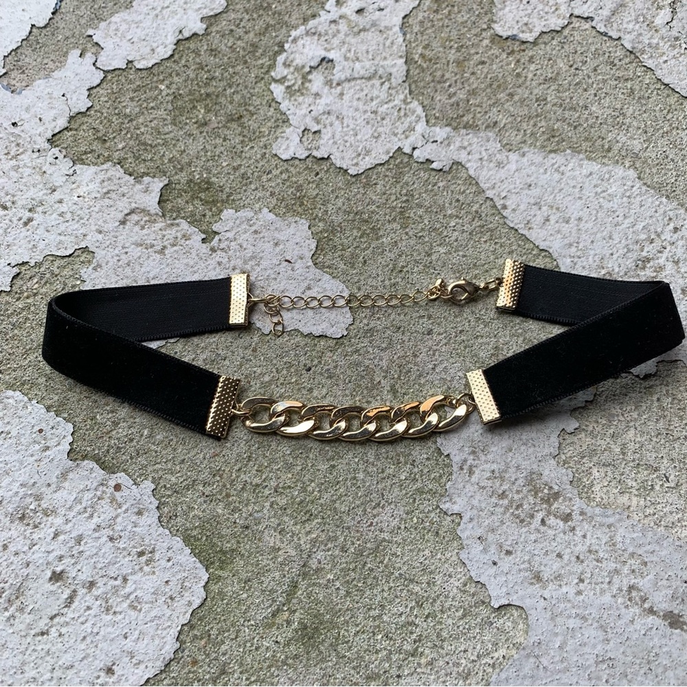 Black velvet choker with gold chain accent